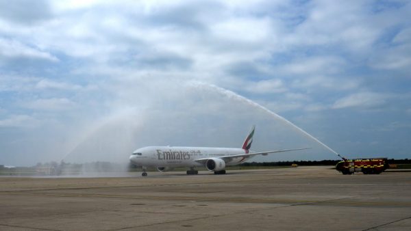 The first Emirates aircraft arriving at London Stansted Airport under a celebratory water arch at the event