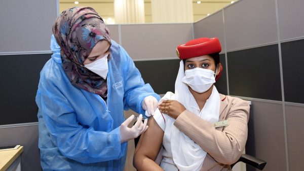 Member of Emirates workforce receiving a Covid-19 vaccination