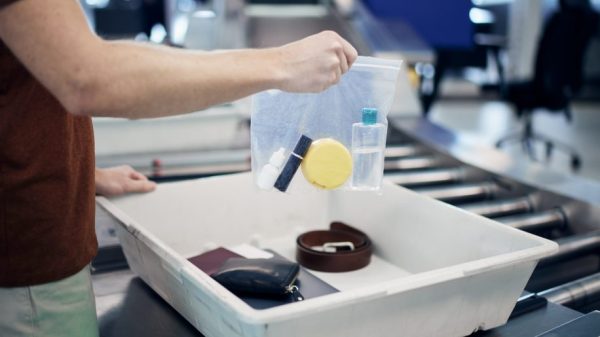 Liquids being removed from hand luggage at airport security (istock.com/Chalabala)